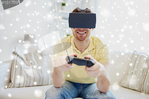 Image of man in virtual reality headset with controller