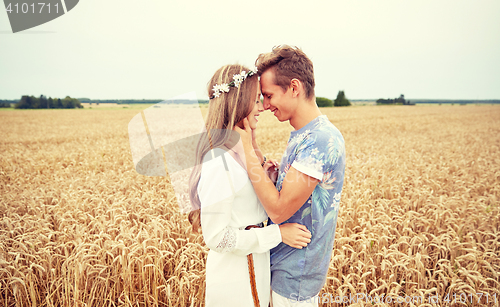 Image of happy smiling young hippie couple outdoors