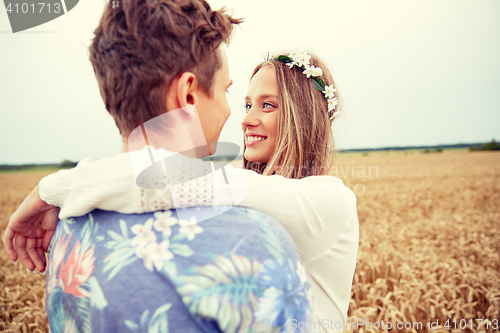 Image of happy smiling young hippie couple outdoors