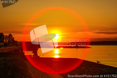 Image of 	Vivid sunset on lake and round cicrle