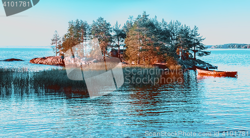 Image of A Small Remote Island Among The Blue Water of Lake