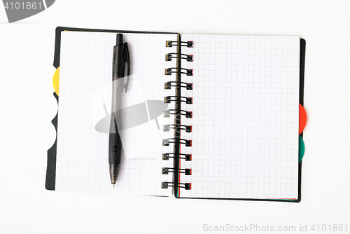 Image of notepad with pen isolated