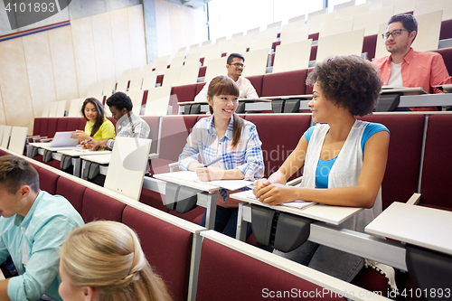 Image of group of international students talking on lecture