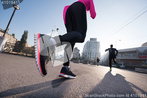 Image of young  couple jogging