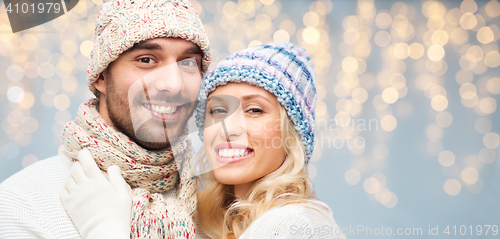 Image of close up of happy couple in winter hats