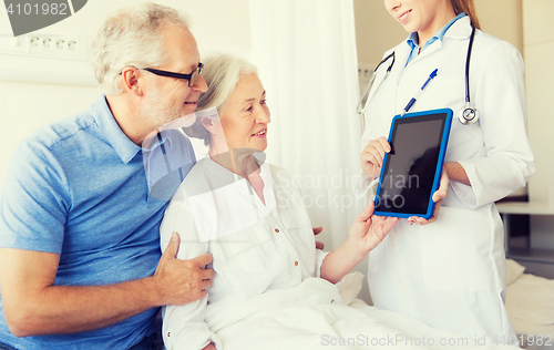 Image of senior woman and doctor with tablet pc at hospital