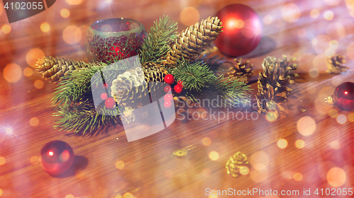 Image of christmas fir branch decoration and candle lantern