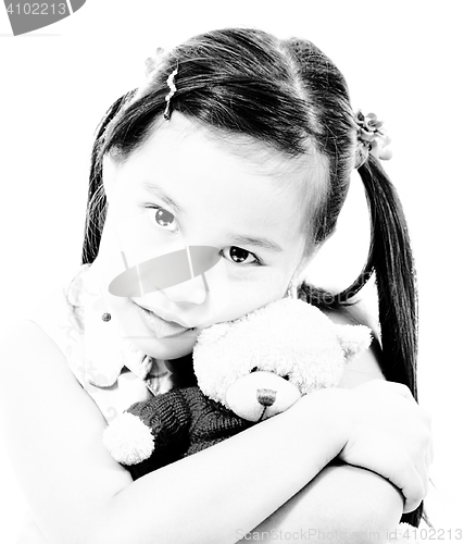Image of Young Cute Girl Hugging Her Teddy Bear