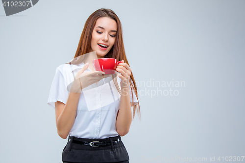 Image of The young business woman on gray background