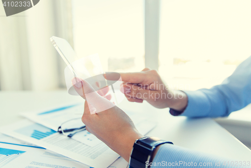 Image of close up of woman with transparent smartphone