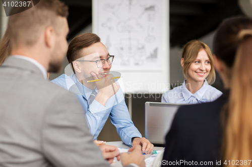 Image of architects with laptop meeting at office