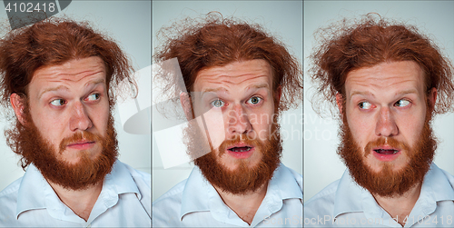 Image of Portrait of young man with shocked facial expression