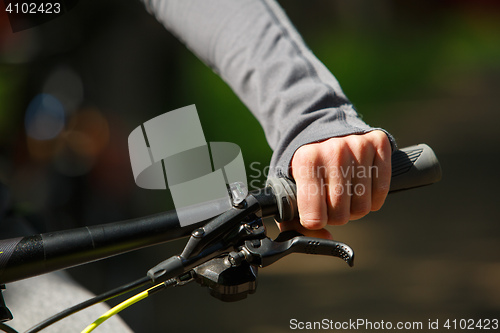 Image of Woman hands on modern sport bike