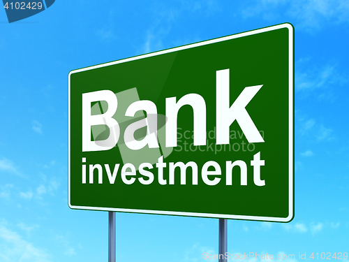 Image of Currency concept: Bank Investment on road sign background