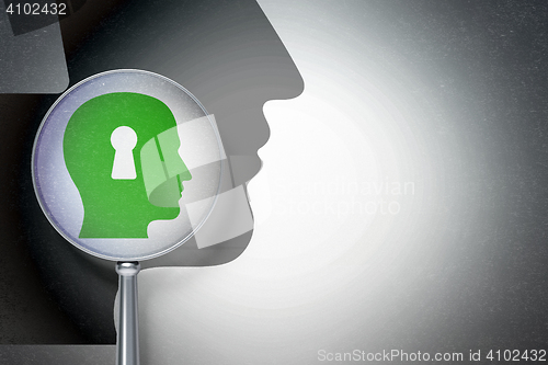 Image of Data concept:  Head With Keyhole with optical glass on digital background