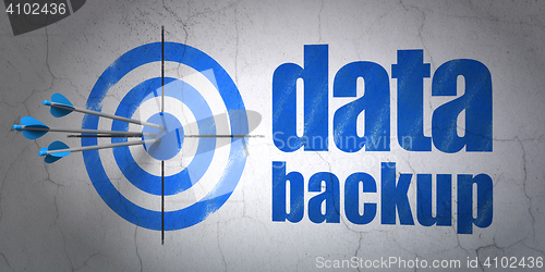 Image of Data concept: target and Data Backup on wall background