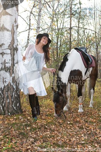 Image of Young Woman And Horse