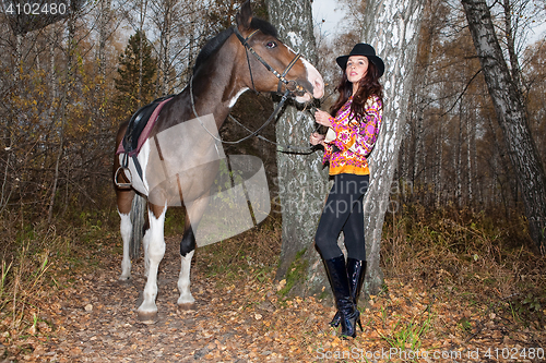 Image of Young Woman And Horse