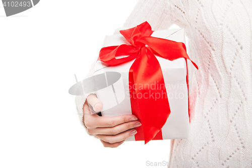 Image of Woman with box of gift in hand on white isolated