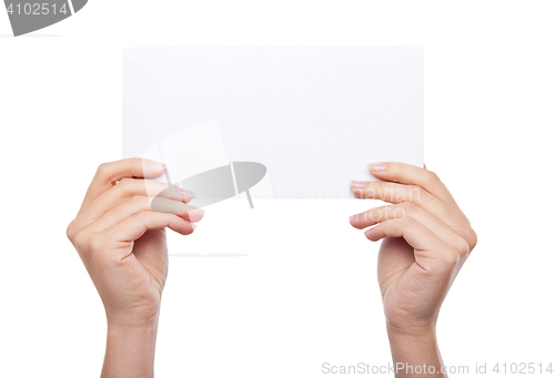 Image of hand holding blank paper isolated 