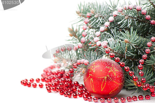 Image of Christmas decorations with branch of tree on white