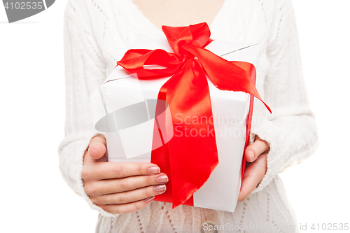 Image of Woman with box of gift in hand on white isolated