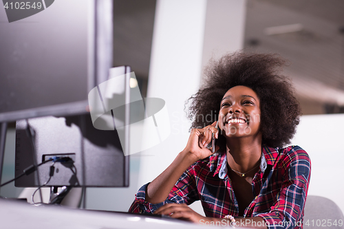 Image of portrait of a young successful African-American woman in modern 