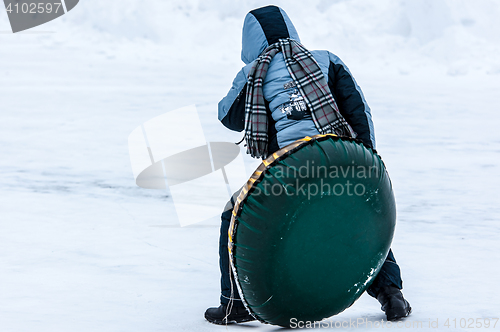 Image of Baby winter sledding on the Ural River,