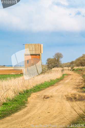 Image of Small house by a countryside road