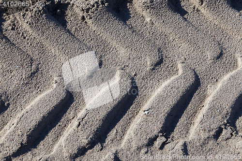 Image of footprints in the sand truck