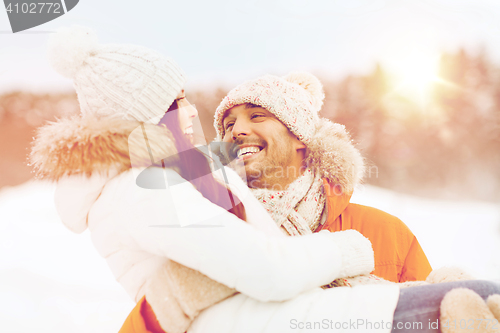 Image of happy couple outdoors in winter