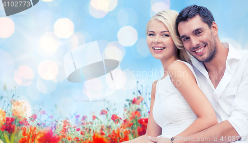 Image of happy couple having fun over poppy flowers field