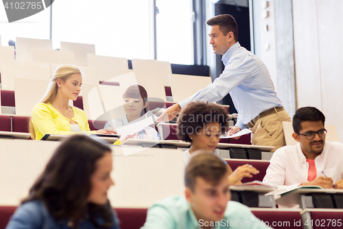 Image of teacher giving test to students on lecture