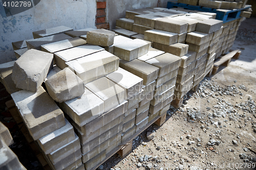 Image of bricks batch on wooden storage pallet