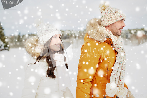 Image of happy couple walking over winter background