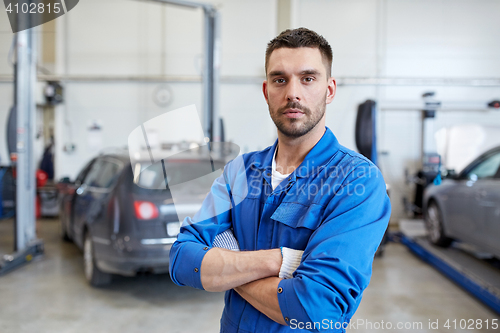 Image of auto mechanic man or smith at car workshop