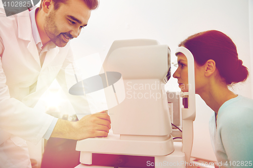 Image of optician with tonometer and patient at eye clinic