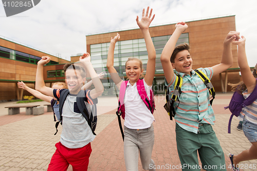 Image of group of happy elementary school students running