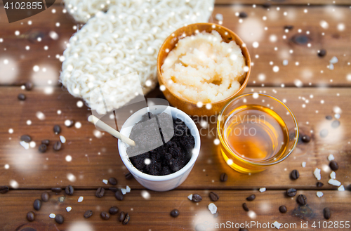 Image of coffee scrub in cup with honey and wisp on wood