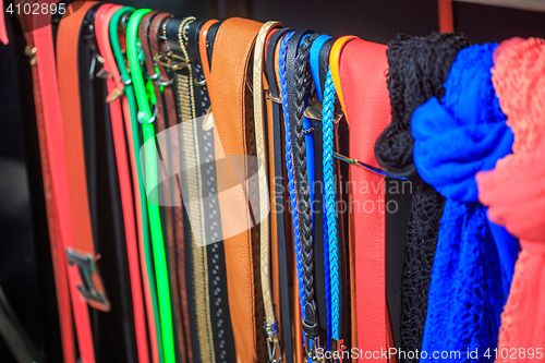 Image of Collection of Colorful  Belts on Rack 