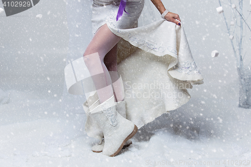 Image of Girl legs in wool boots