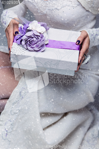 Image of Bride holding present box