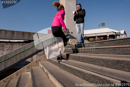 Image of woman jogging on  steps