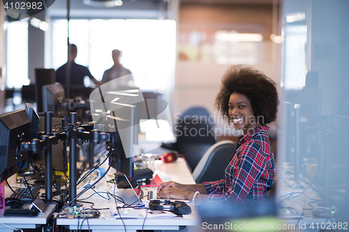 Image of portrait of a young successful African-American woman in modern 