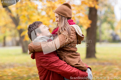 Image of happy young couple meeting in autumn park