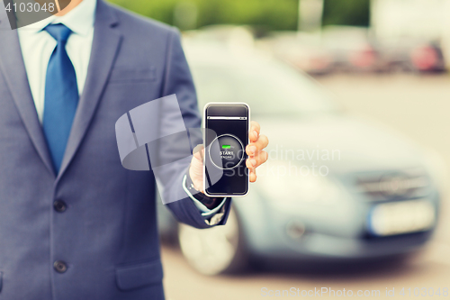 Image of close up of business man with smartphone app