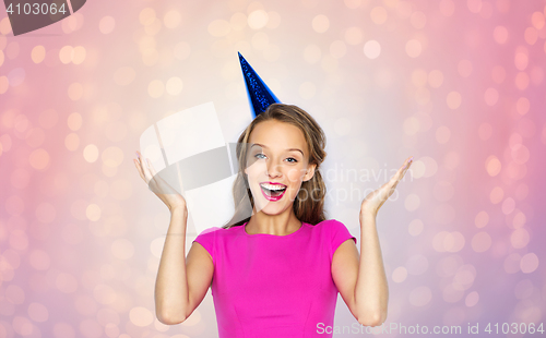 Image of happy young woman or teen girl in party cap