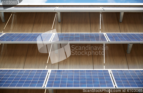 Image of solar battery panels on building facade