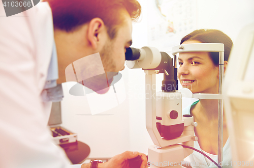 Image of optician with tonometer and patient at eye clinic