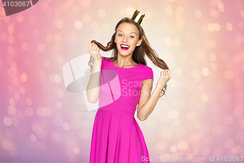 Image of happy young woman or teen girl in princess crown